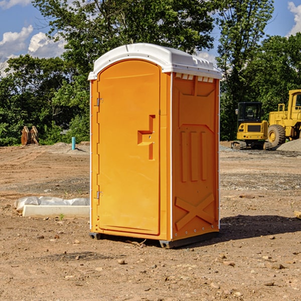 how often are the portable restrooms cleaned and serviced during a rental period in Scott County